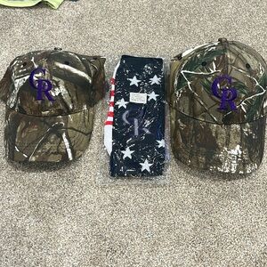 Two Colorado Rockies hats, and a pair of socks